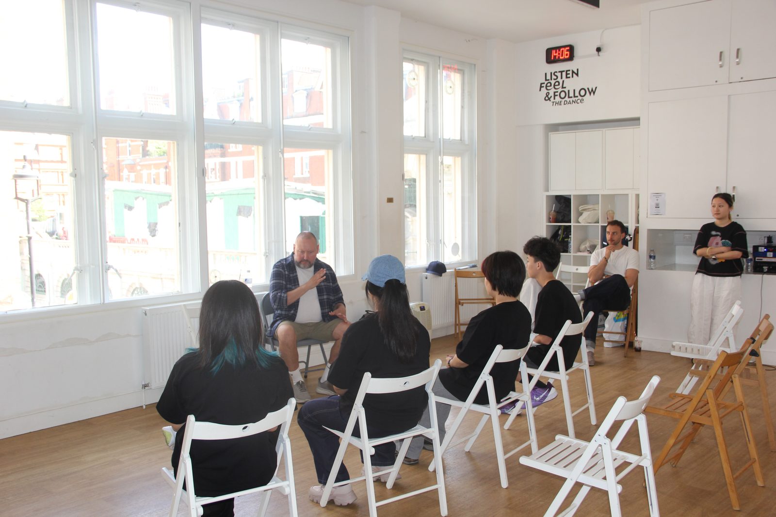Students and a practitioner in a bright London rehearsal studio