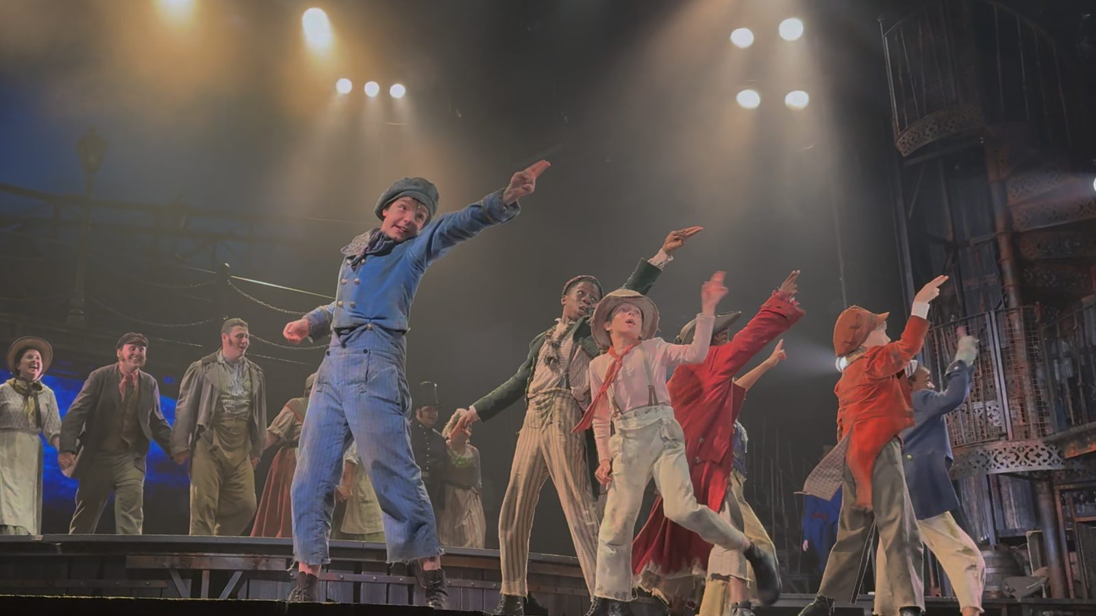 A company on stage in a West End production